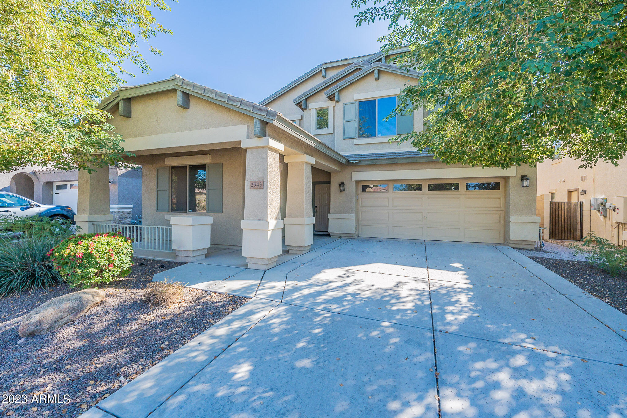 2943 East Quiet Hollow Lane Phoenix, AZ 85024 - Photo 2 of 65 a front view of a house with a yard and garage