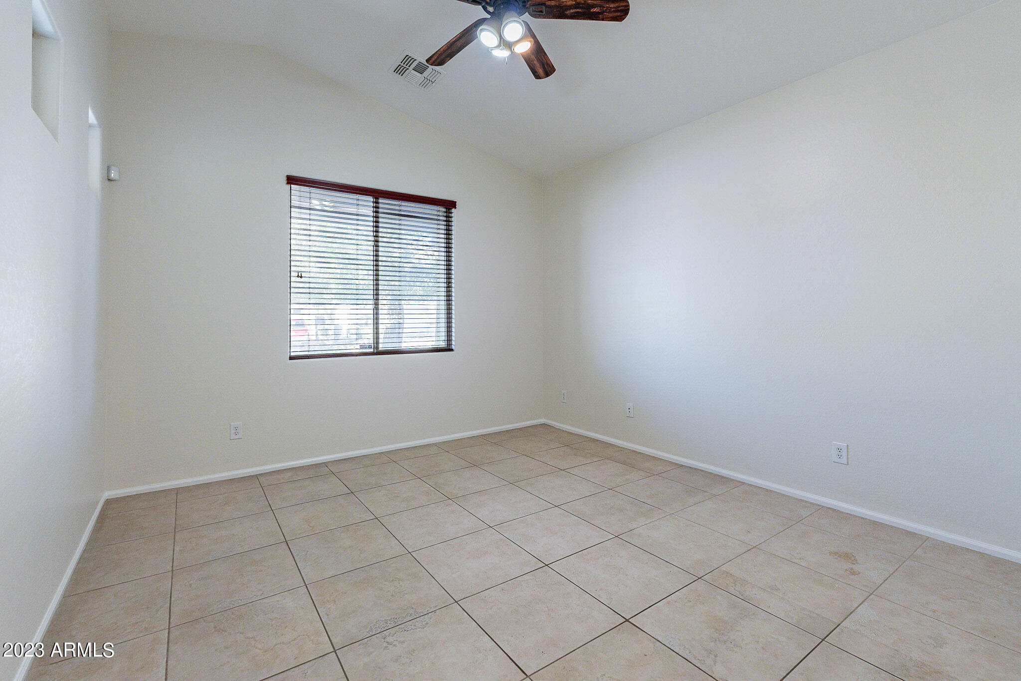 2943 East Quiet Hollow Lane Phoenix, AZ 85024 - Photo 25 of 65 an empty room with a window