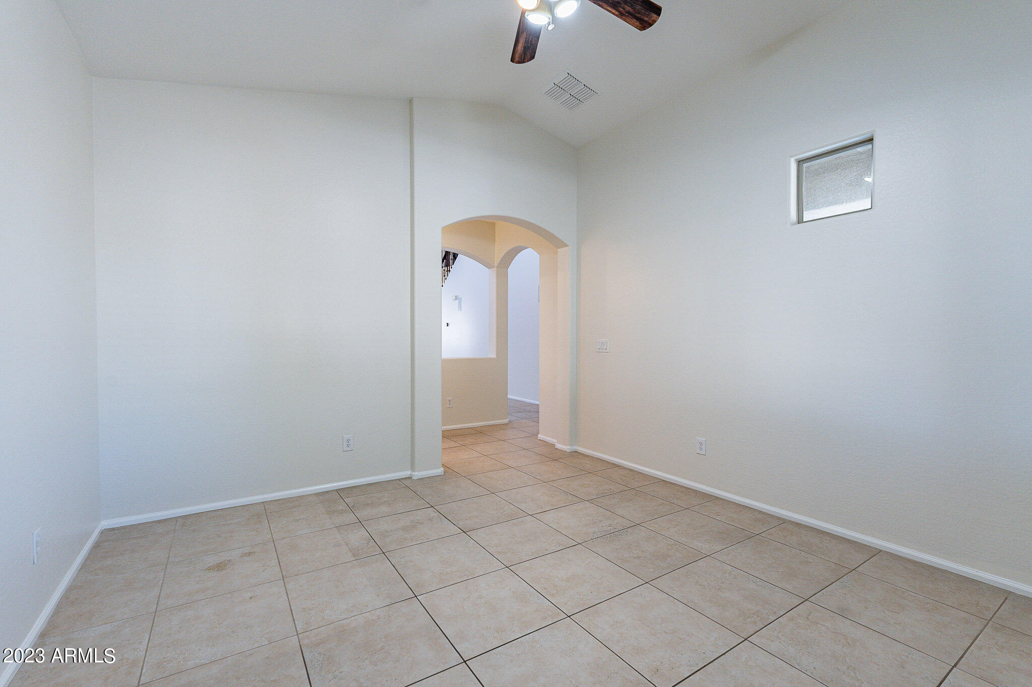 2943 East Quiet Hollow Lane Phoenix, AZ 85024 - Photo 26 of 65 an empty room with closet and chandelier fan