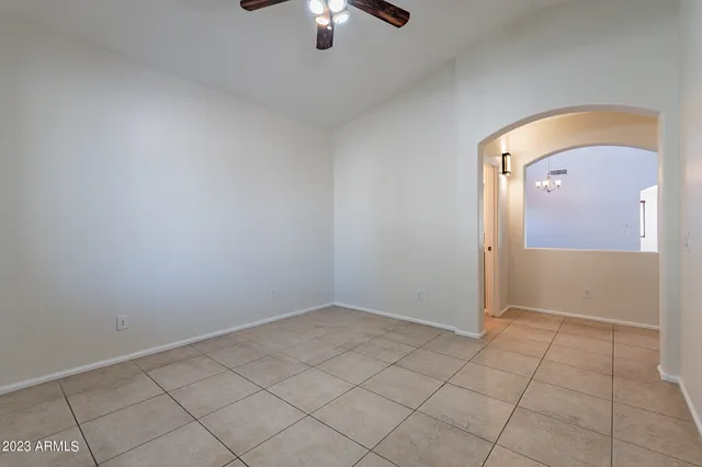 a view of a big room with closet and ceiling fan