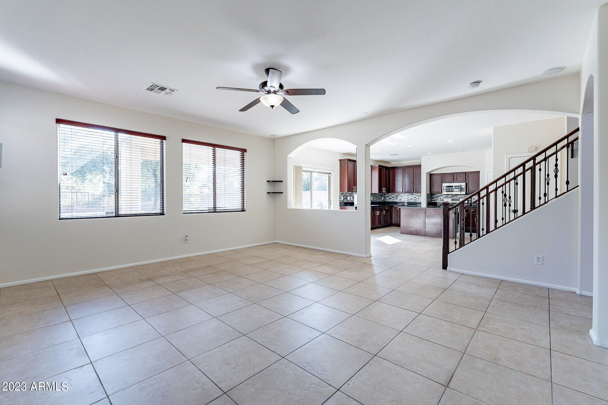 2943 East Quiet Hollow Lane Phoenix, AZ 85024 - Photo 32 of 65 a view of main area with chandelier fan and windows