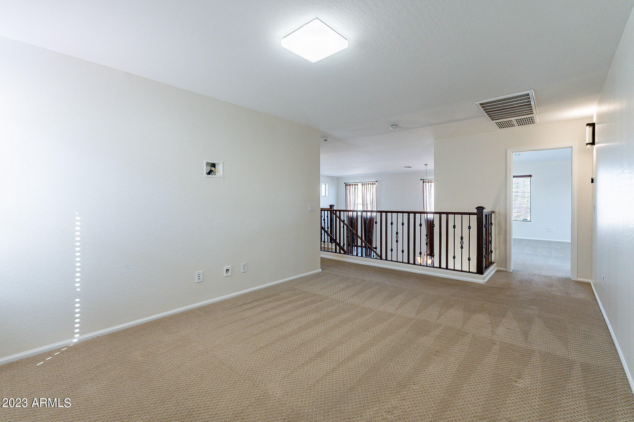 2943 East Quiet Hollow Lane Phoenix, AZ 85024 - Photo 34 of 65 a view of a hallway with a window