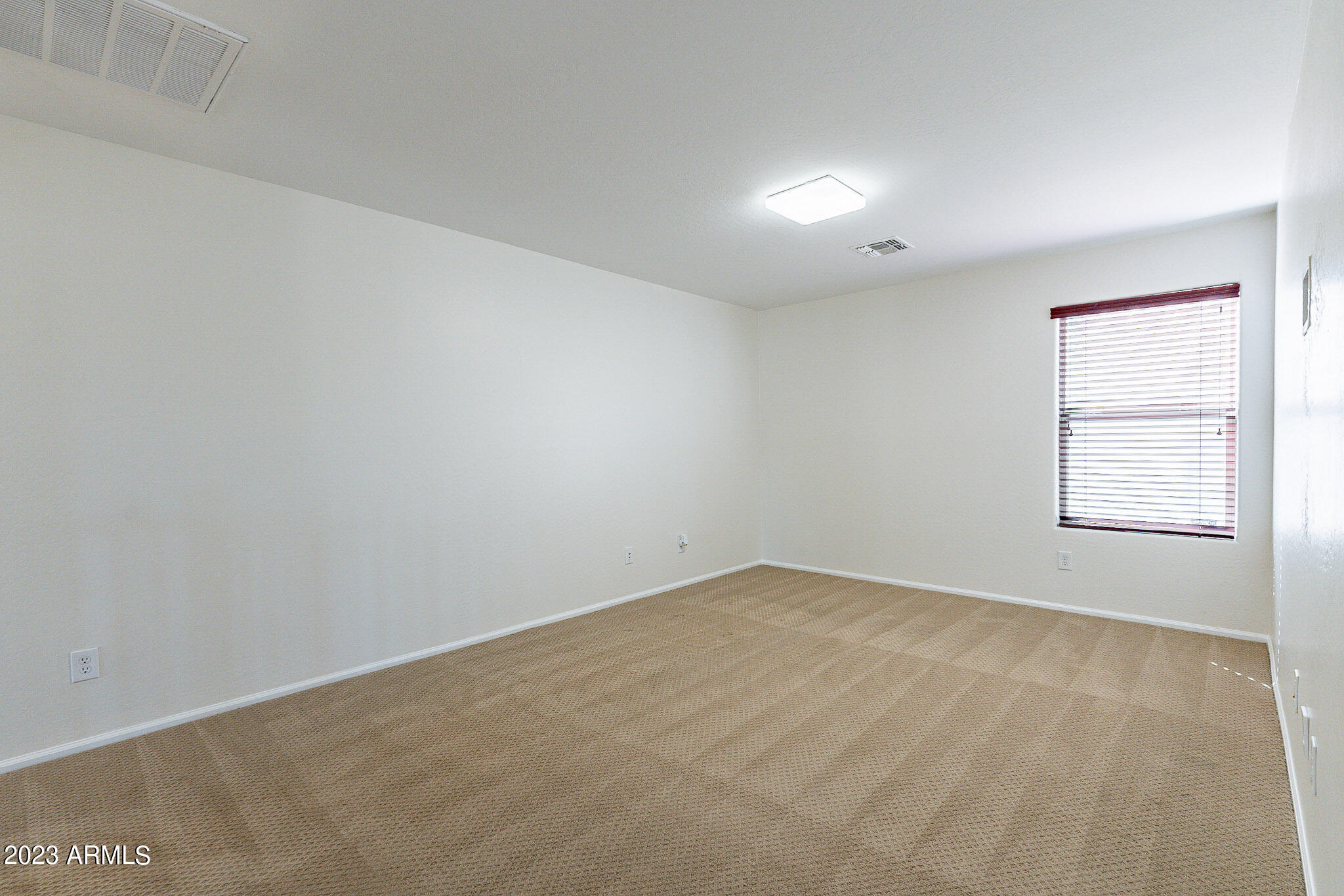 2943 East Quiet Hollow Lane Phoenix, AZ 85024 - Photo 37 of 65 an empty room with windows