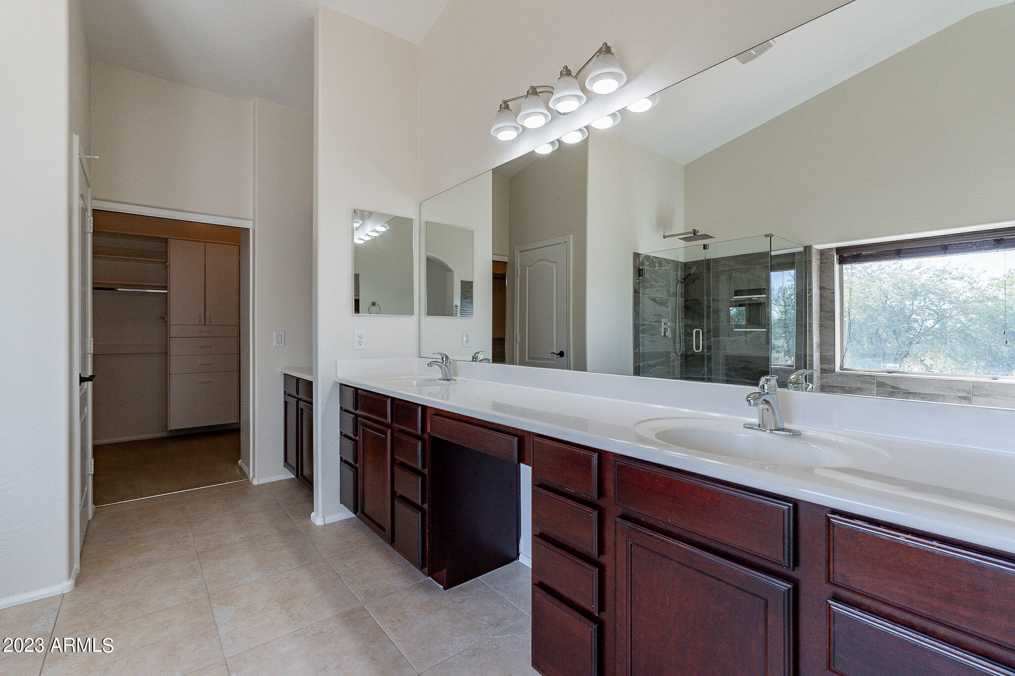 2943 East Quiet Hollow Lane Phoenix, AZ 85024 - Photo 44 of 65 a bathroom with a double vanity sink and a mirror
