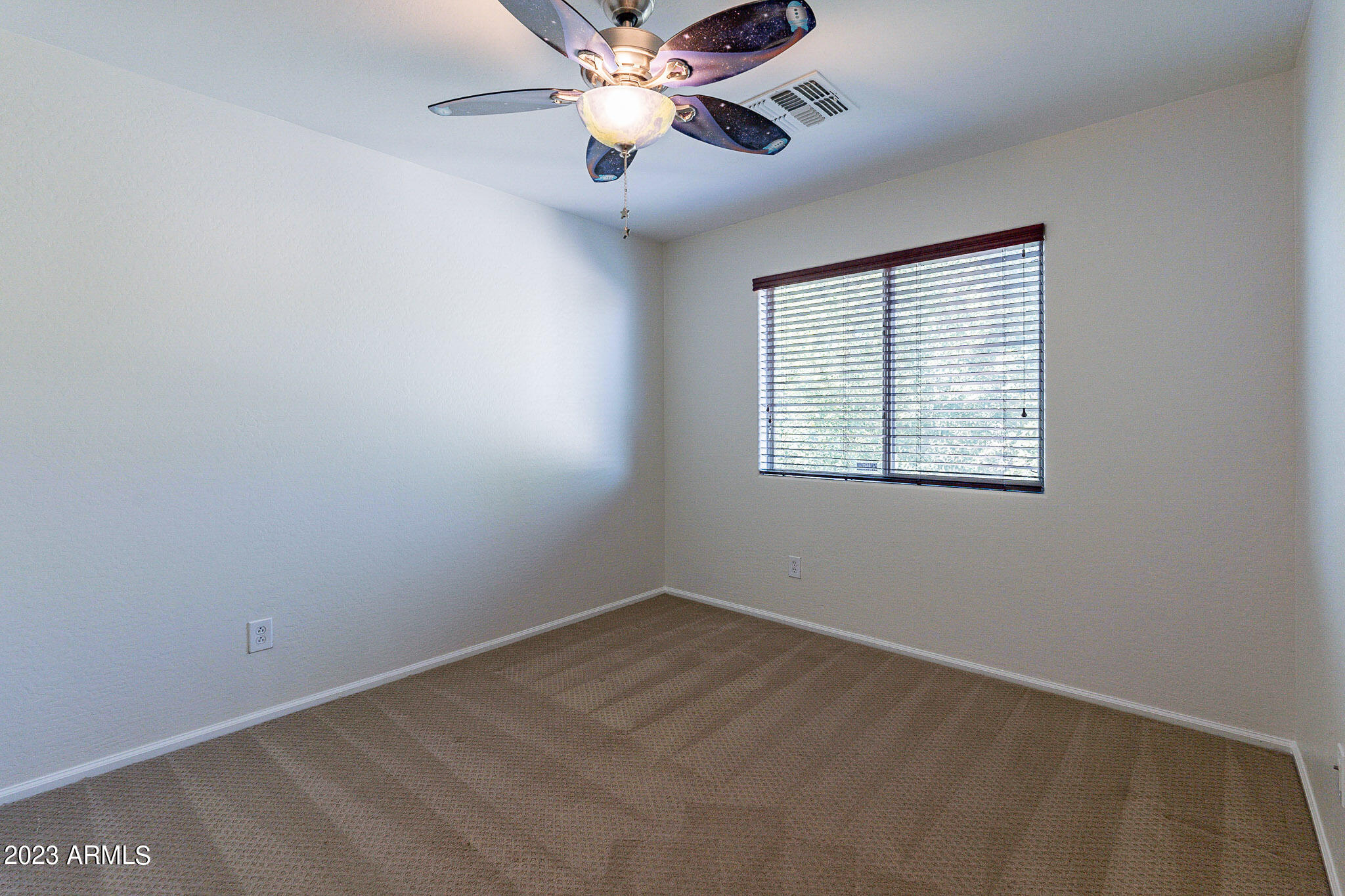 2943 East Quiet Hollow Lane Phoenix, AZ 85024 - Photo 50 of 65 a view of an empty room with a window