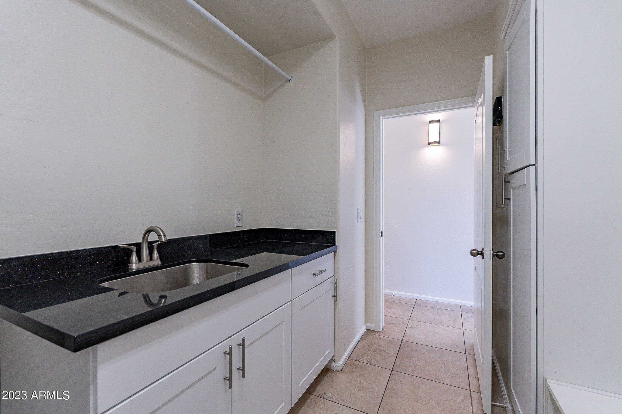 2943 East Quiet Hollow Lane Phoenix, AZ 85024 - Photo 56 of 65 a close view of a sink and dishwasher in a bathroom