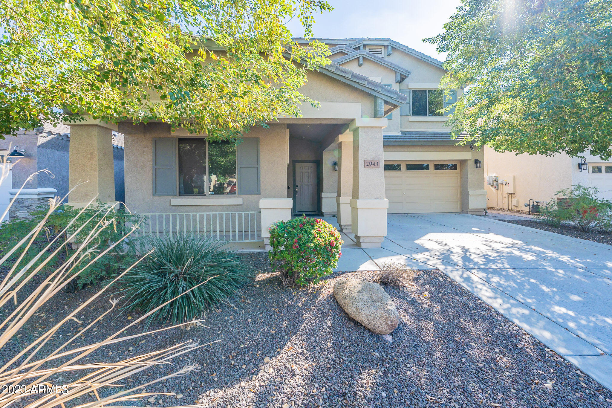 2943 East Quiet Hollow Lane Phoenix, AZ 85024 - Photo 6 of 65 a front view of a house with garden
