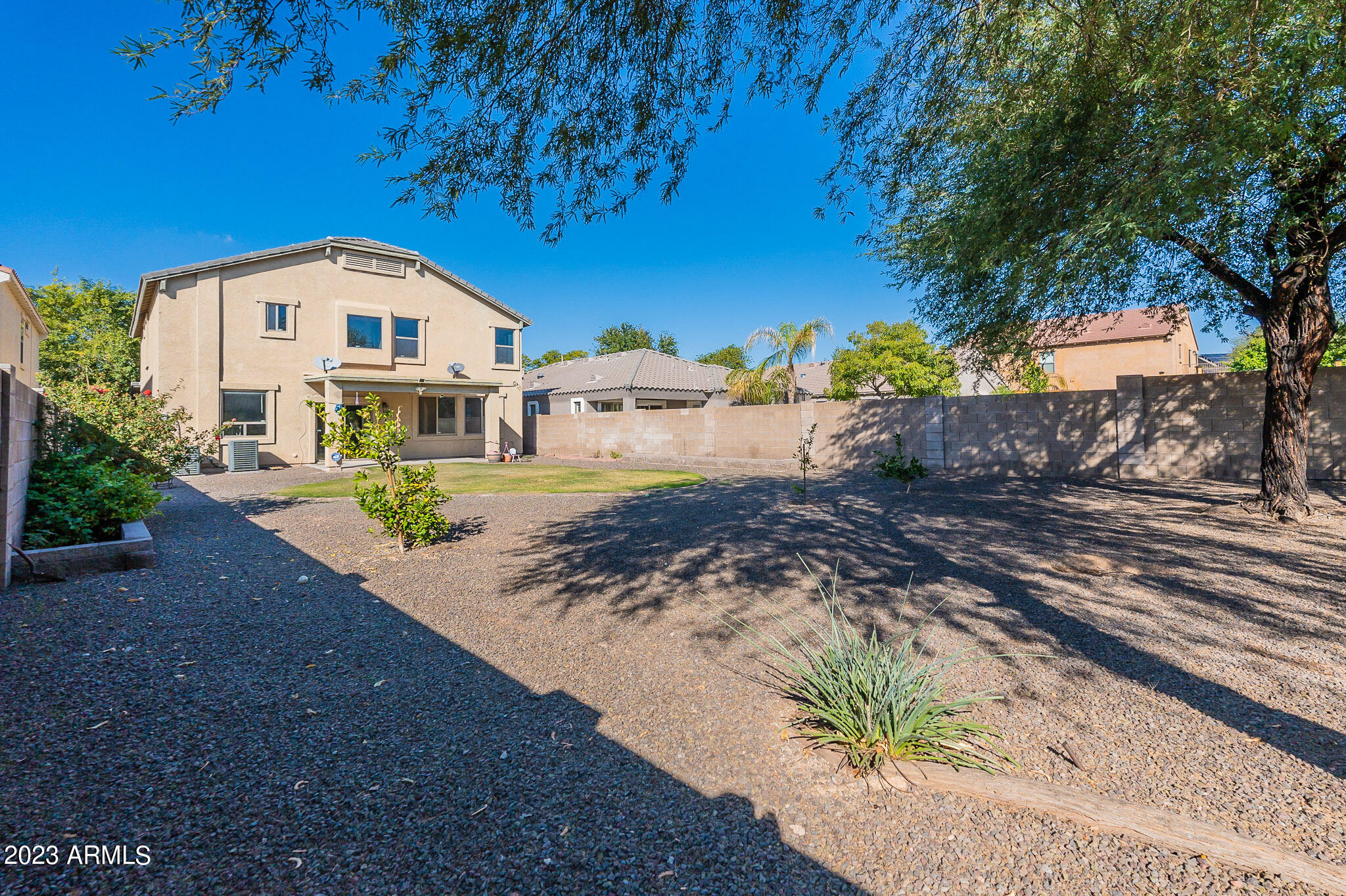 2943 East Quiet Hollow Lane Phoenix, AZ 85024 - Photo 65 of 65 a front view of a house with a yard