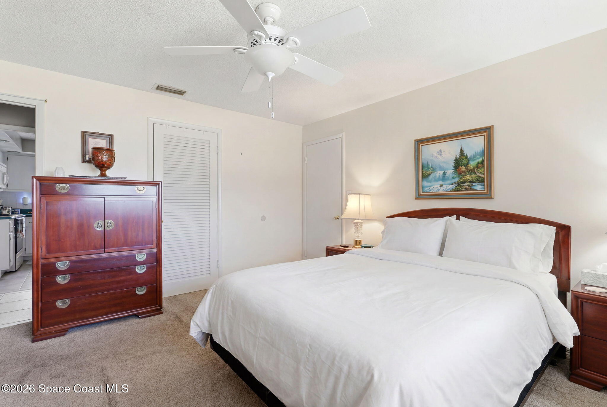 908 Jefferson Road Rockledge, FL 32955 - Photo 9 of 37 a bedroom with a bed and a dresser