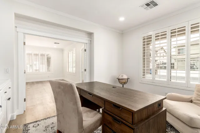 a view of a dining room with furniture and window