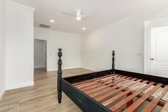 a view of a room with wooden floor