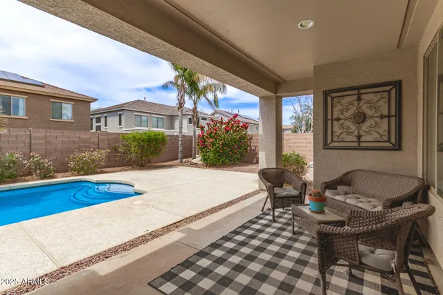 a bedroom with furniture and a window