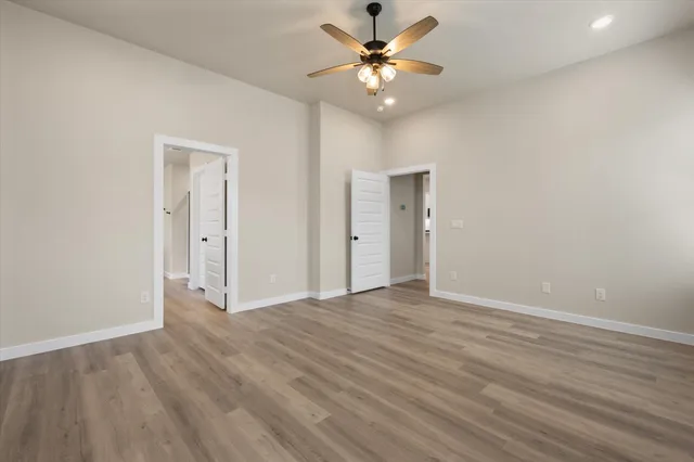 a view of an empty room with a fan