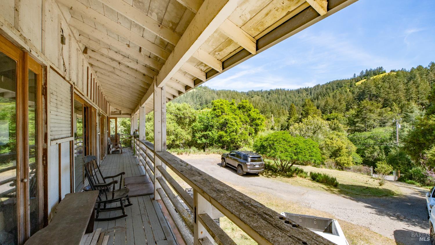 1 Alamo Way Lagunitas, CA 94938 - Photo 17 of 47 a view of a balcony with wooden floor and iron stairs