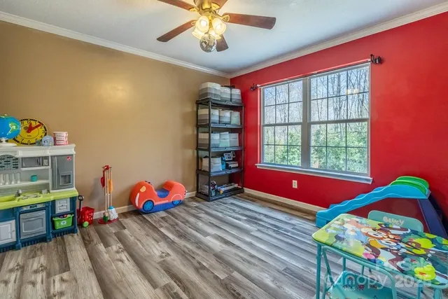 a kids room with toys and dresser