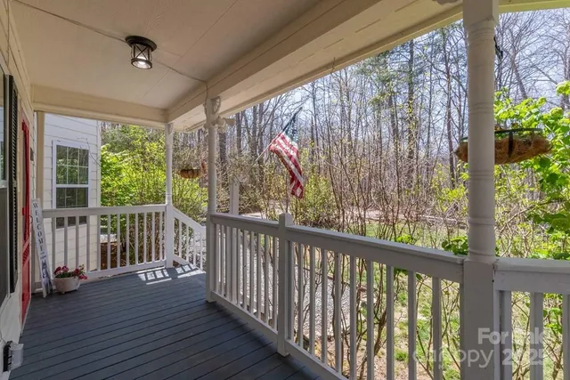 a view of a porch with wooden floor and outdoor space