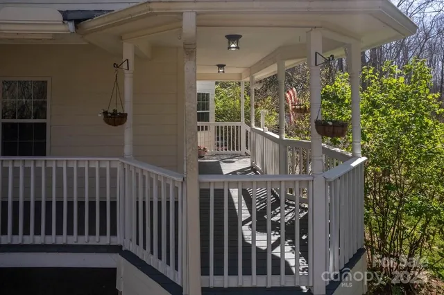 a view of balcony with wooden floor