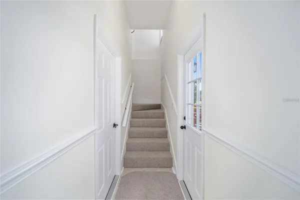 a bedroom with a bed dresser and a flat screen tv