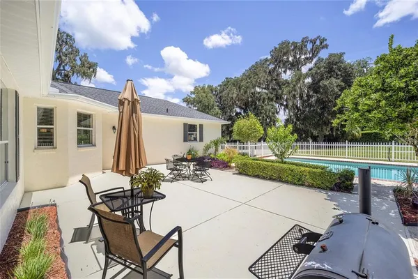 a view of a swimming pool with a patio