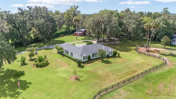 an aerial view of a house with a garden