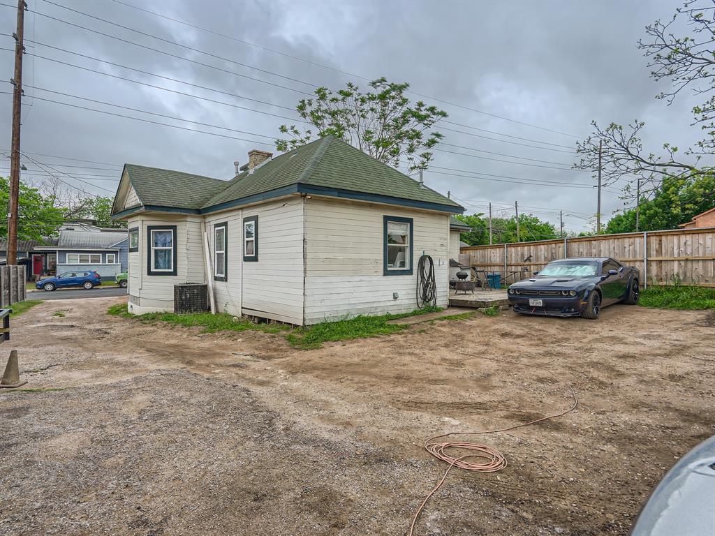 1122 Chicon Street Austin, TX 78702 - Photo 18 of 20 a house with a yard and garage