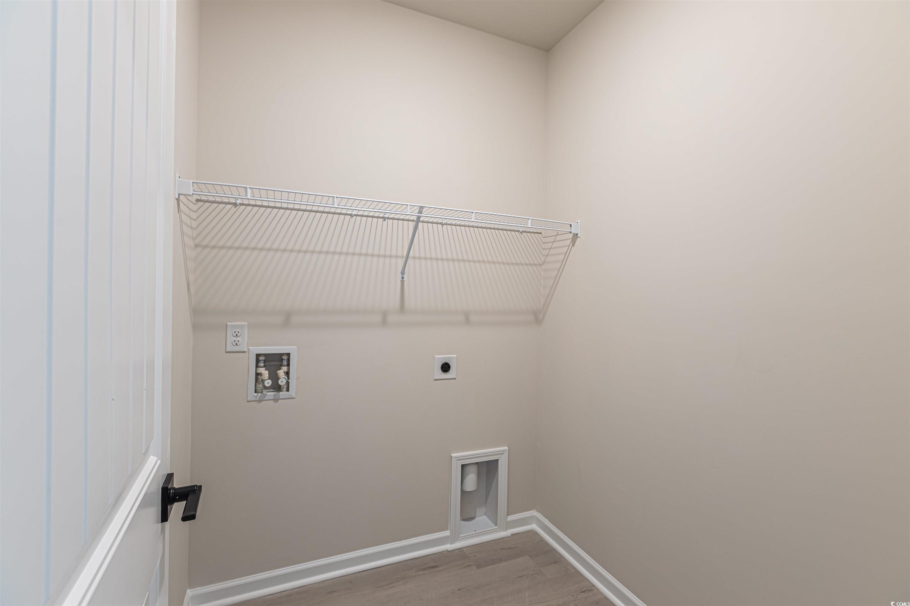 556 Honeyhill Loop Conway, SC 29526 - Photo 12 of 40 Clothes washing area featuring wood finished floor