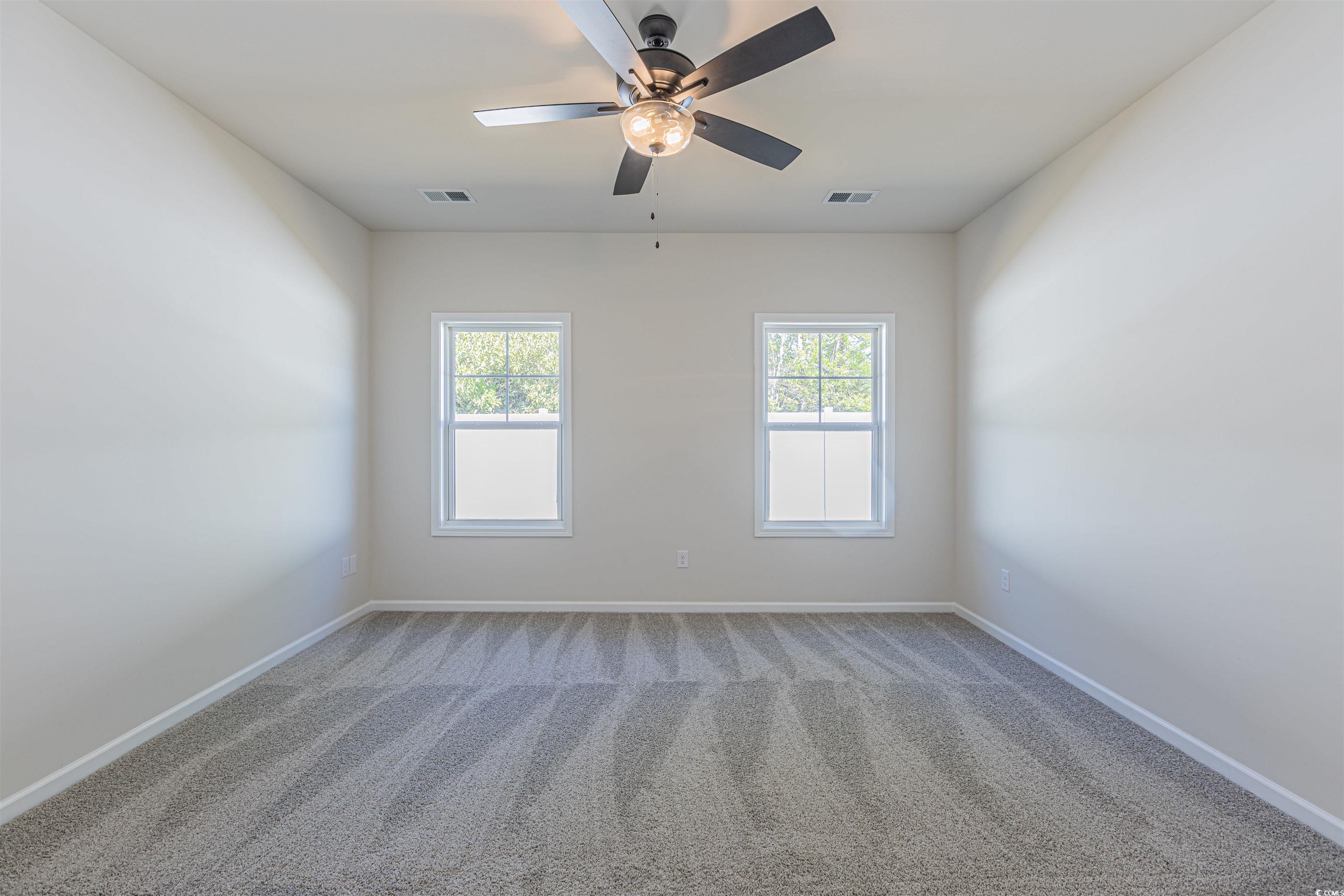 556 Honeyhill Loop Conway, SC 29526 - Photo 13 of 40 Spare room with visible vents, baseboards, carpet,