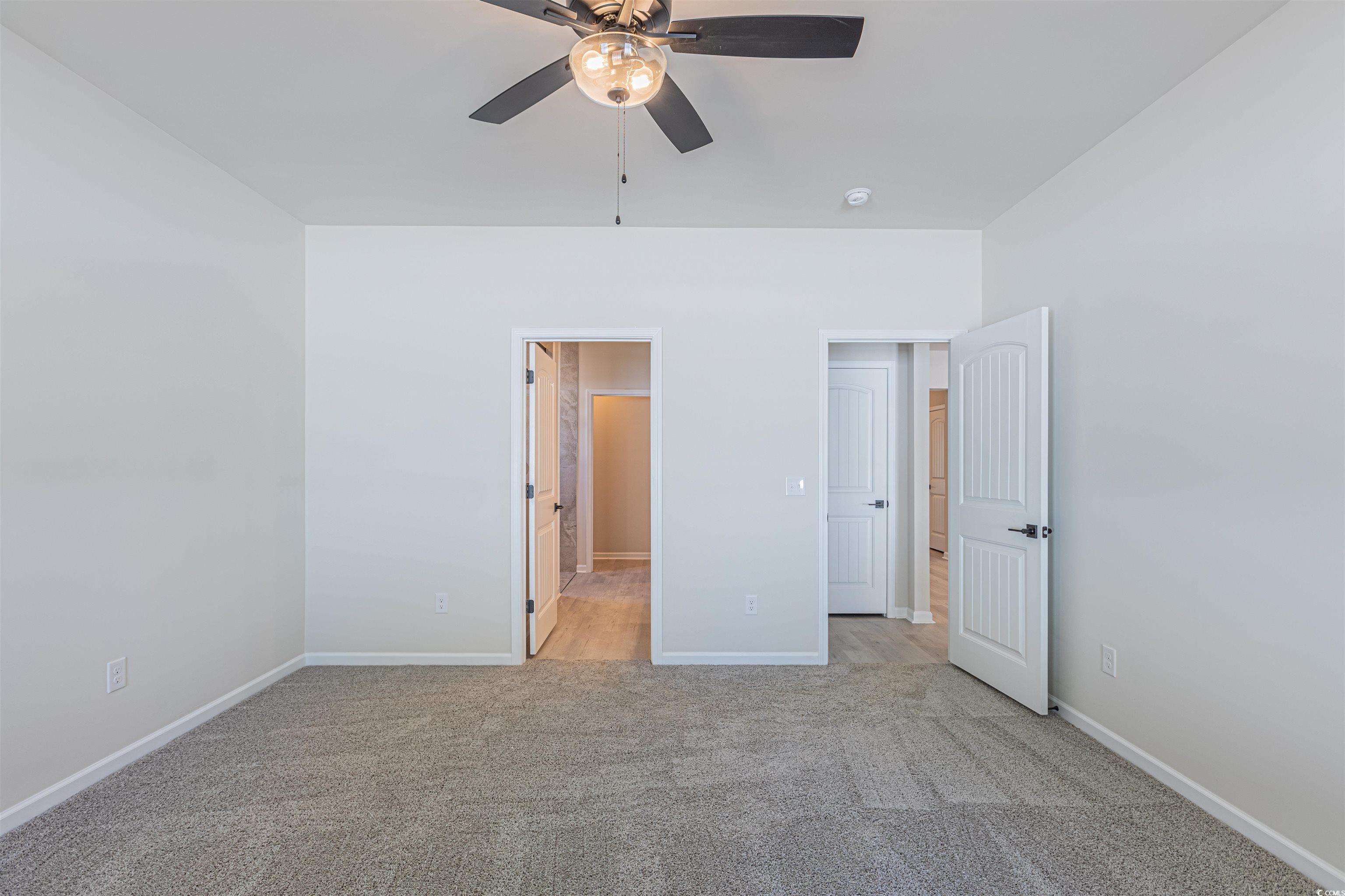 556 Honeyhill Loop Conway, SC 29526 - Photo 14 of 40 Unfurnished bedroom with a ceiling fan, light colo