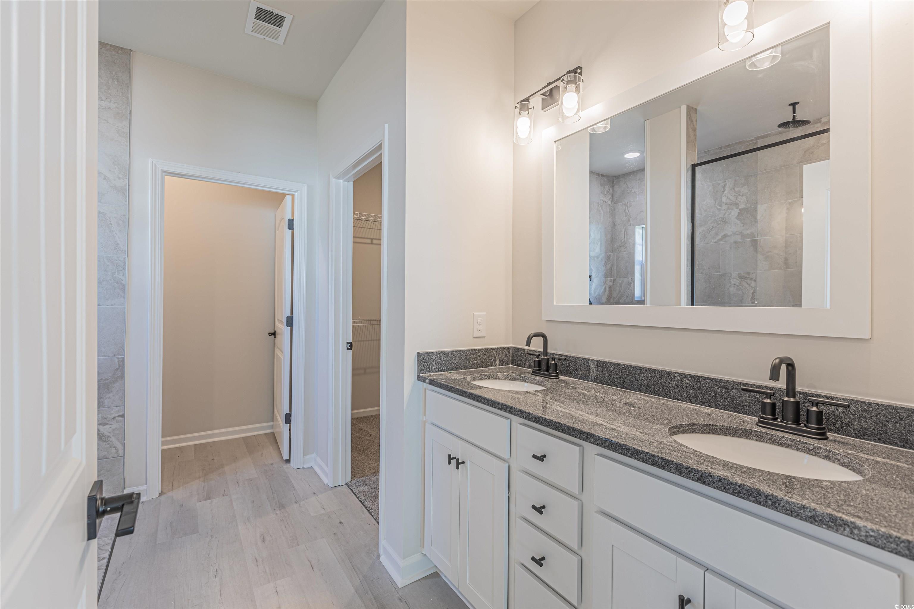 556 Honeyhill Loop Conway, SC 29526 - Photo 15 of 40 Bathroom featuring visible vents, a stall shower,