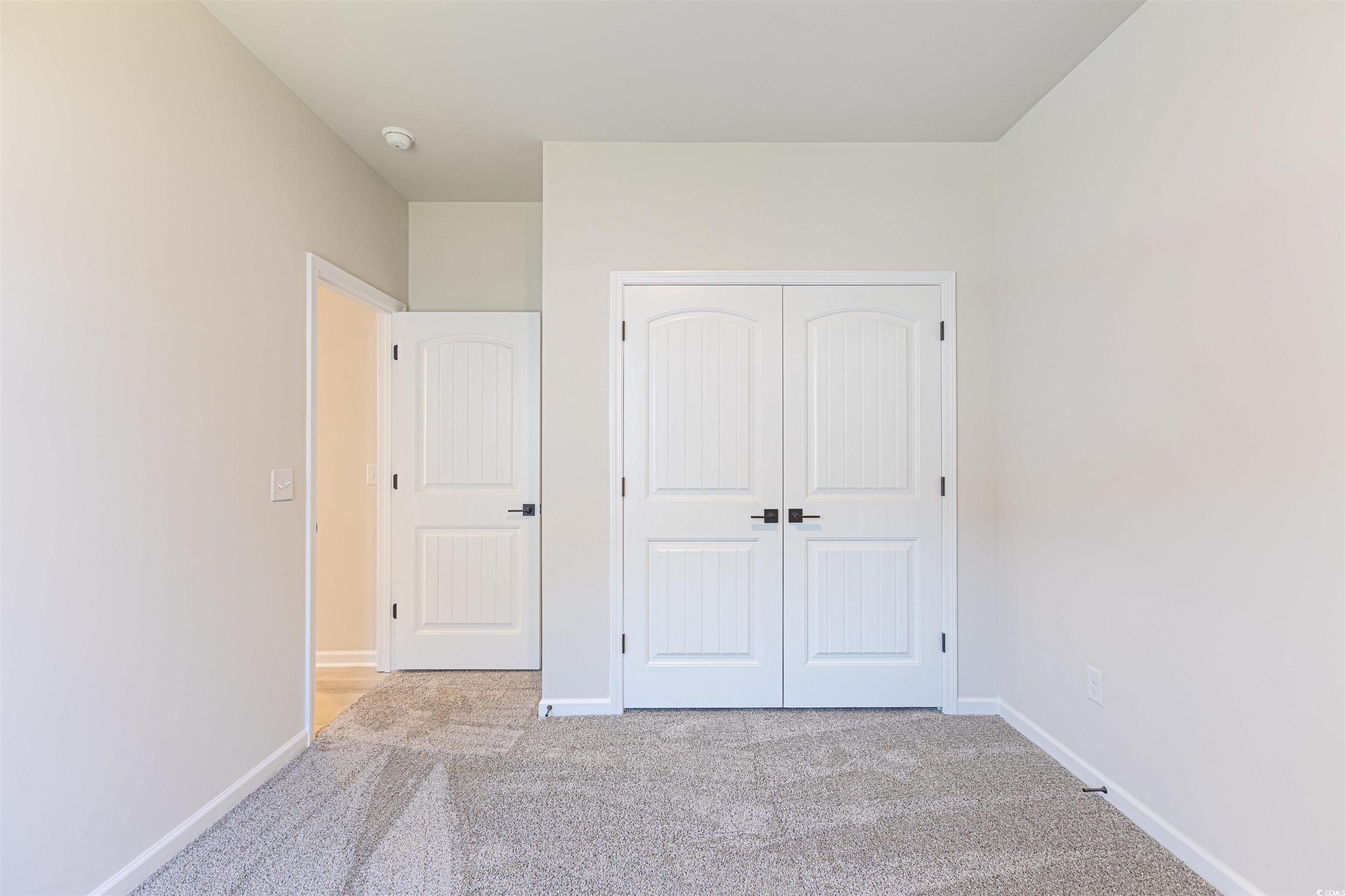 556 Honeyhill Loop Conway, SC 29526 - Photo 9 of 40 Unfurnished bedroom featuring carpet flooring, bas