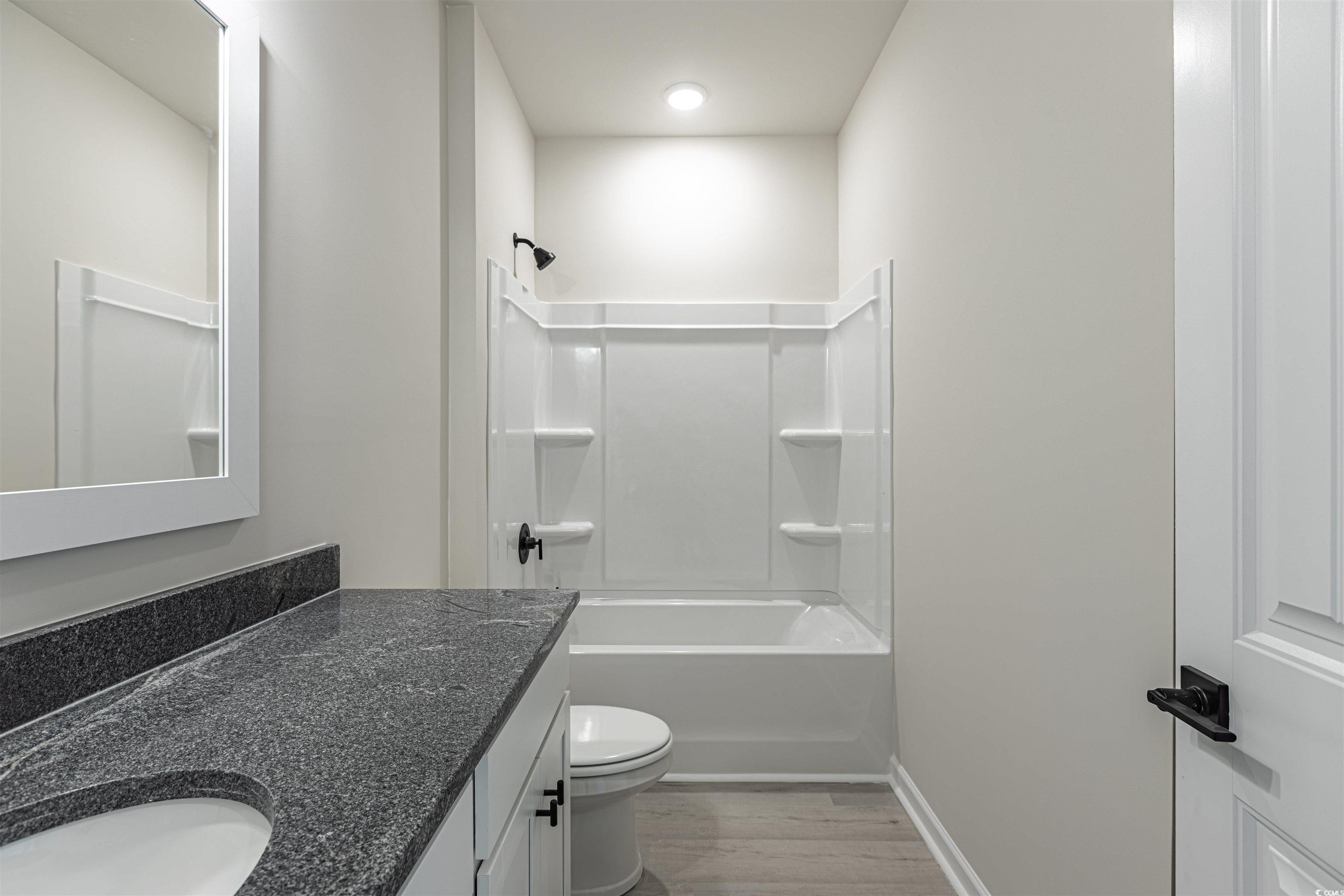 556 Honeyhill Loop Conway, SC 29526 - Photo 10 of 40 Bathroom featuring vanity, wood finished floors, b