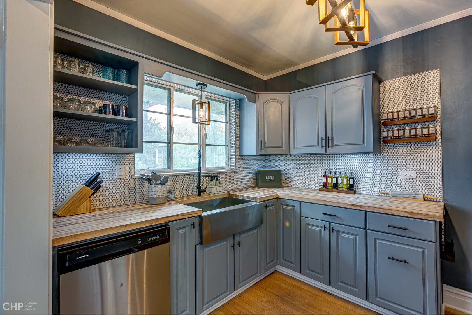 310 Shenstone Road Riverside, IL 60546 - Photo 15 of 32 a kitchen with a sink a cabinets and window