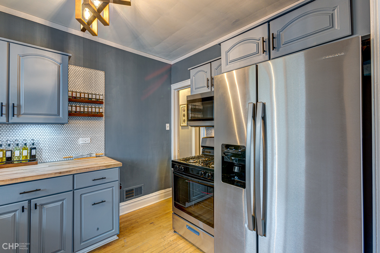 310 Shenstone Road Riverside, IL 60546 - Photo 17 of 32 a kitchen with stainless steel appliances a refrigerator stove and sink