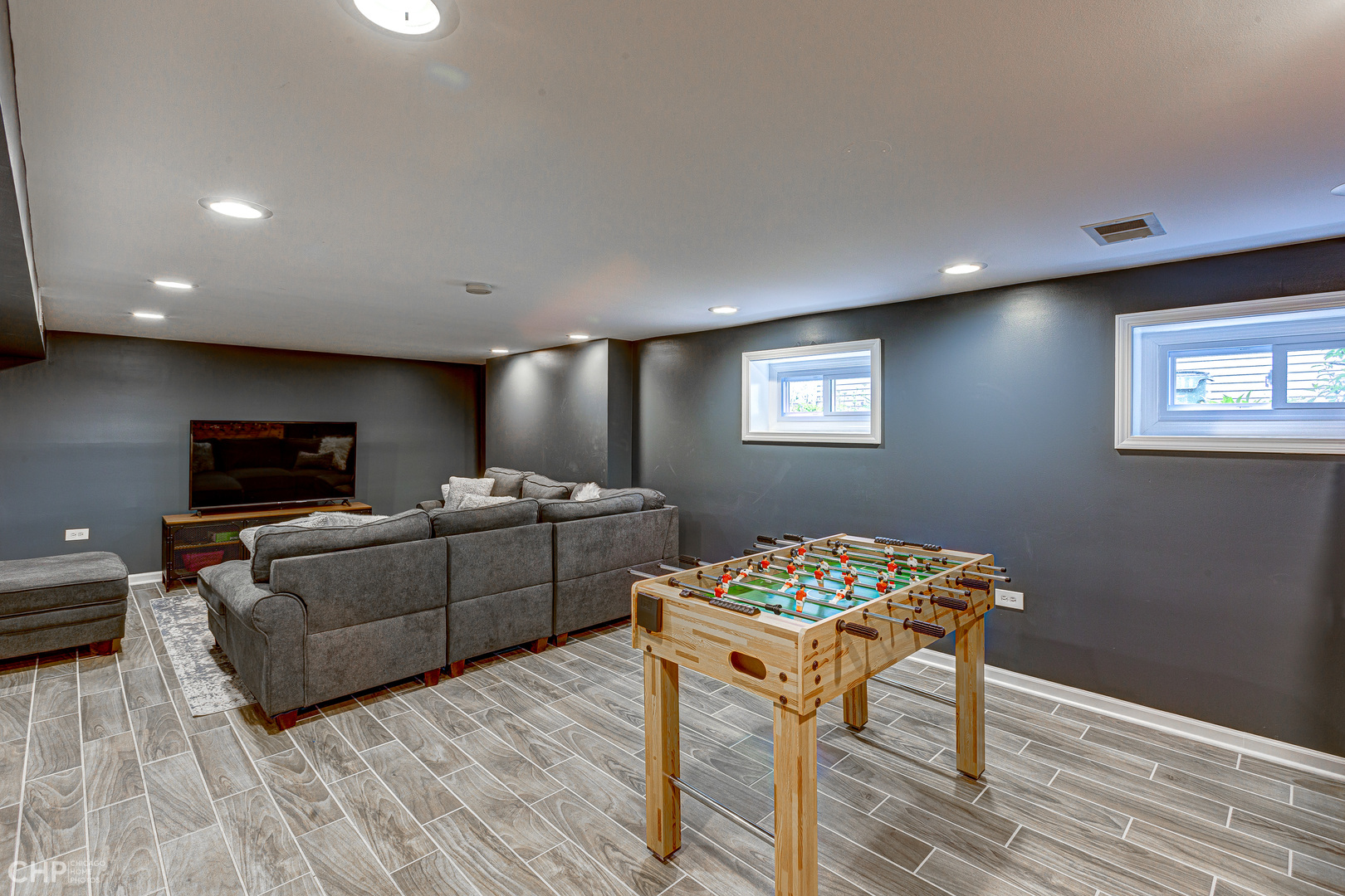 310 Shenstone Road Riverside, IL 60546 - Photo 21 of 32 a living room with furniture and a flat screen tv