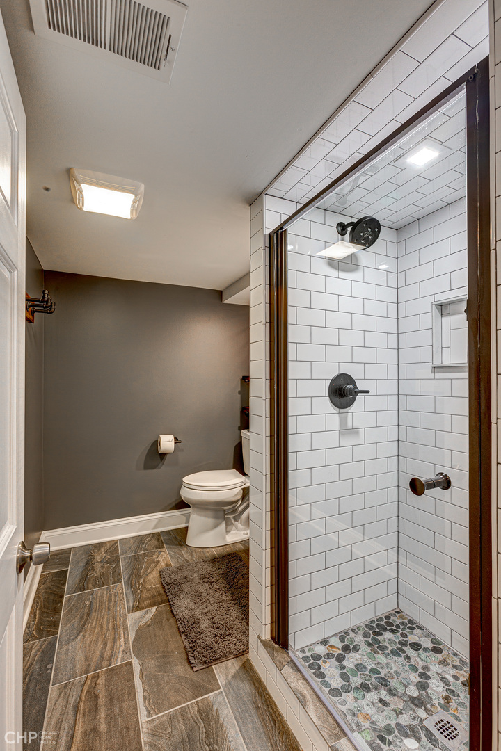 310 Shenstone Road Riverside, IL 60546 - Photo 26 of 32 a bathroom with a toilet and shower