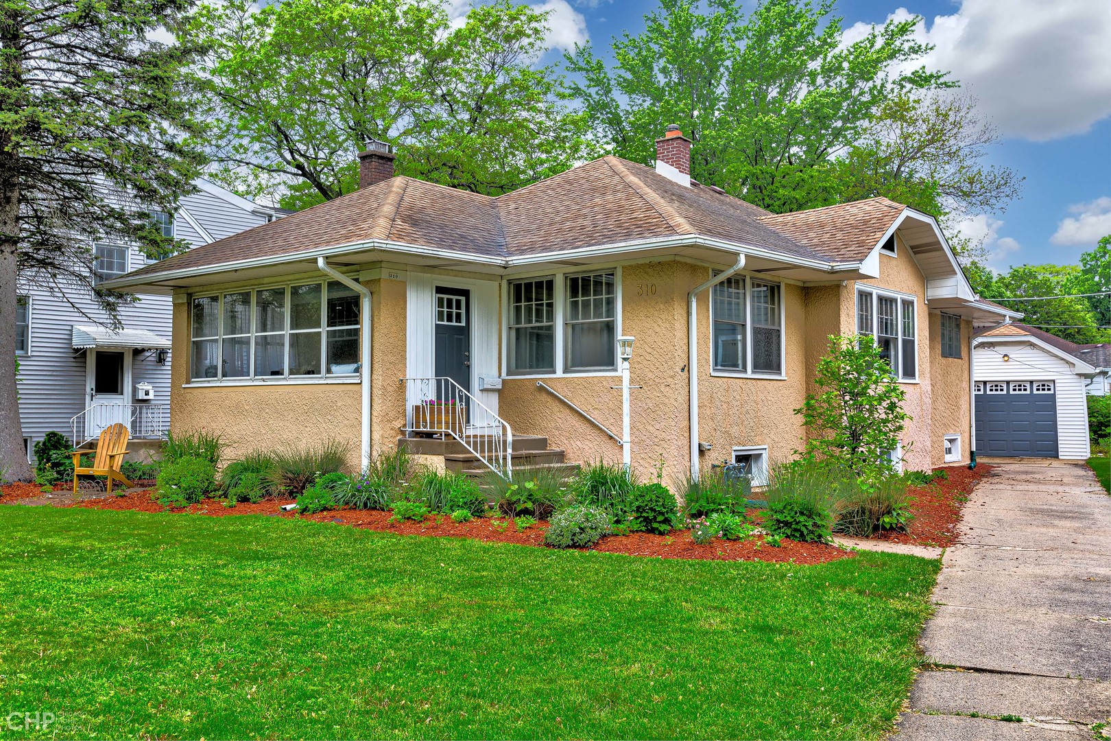 310 Shenstone Road Riverside, IL 60546 - Photo 32 of 32 a front view of a house with a garden