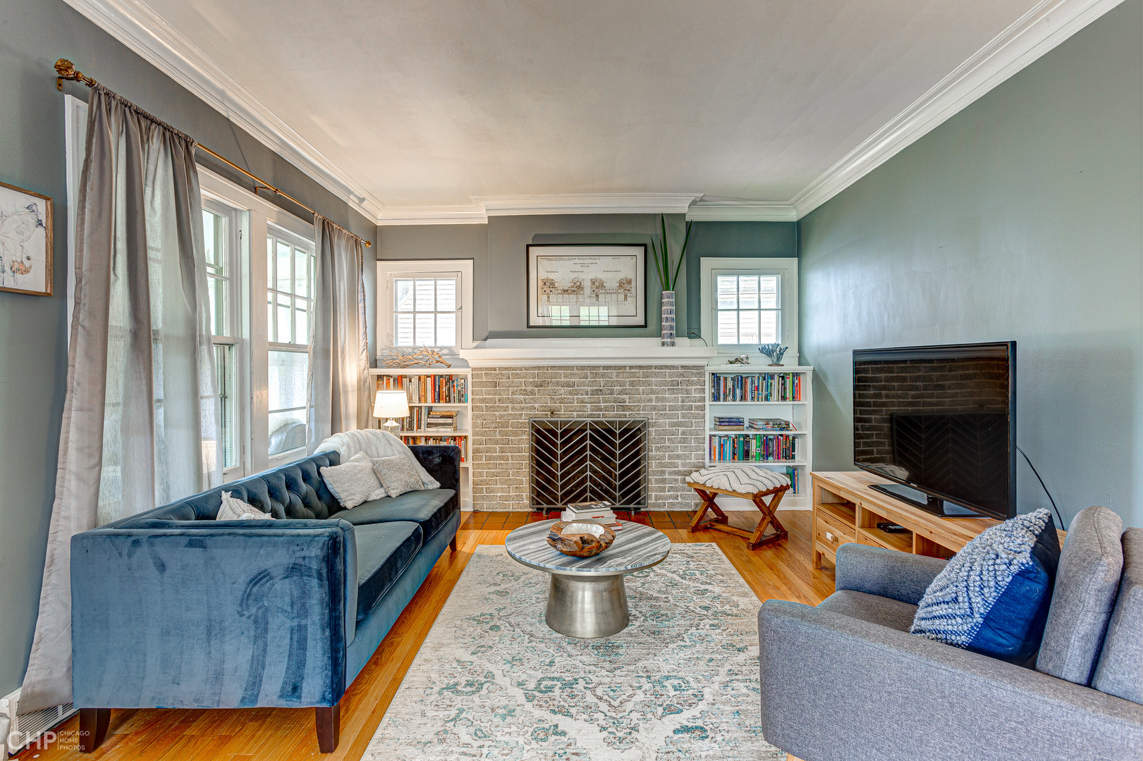310 Shenstone Road Riverside, IL 60546 - Photo 6 of 32 a living room with furniture and a fireplace