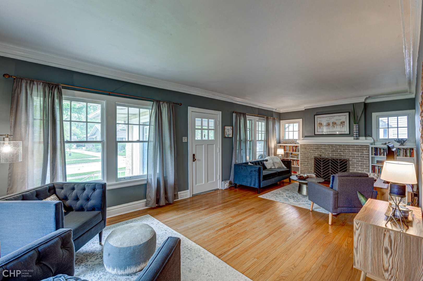 310 Shenstone Road Riverside, IL 60546 - Photo 8 of 32 a living room with furniture and a fireplace