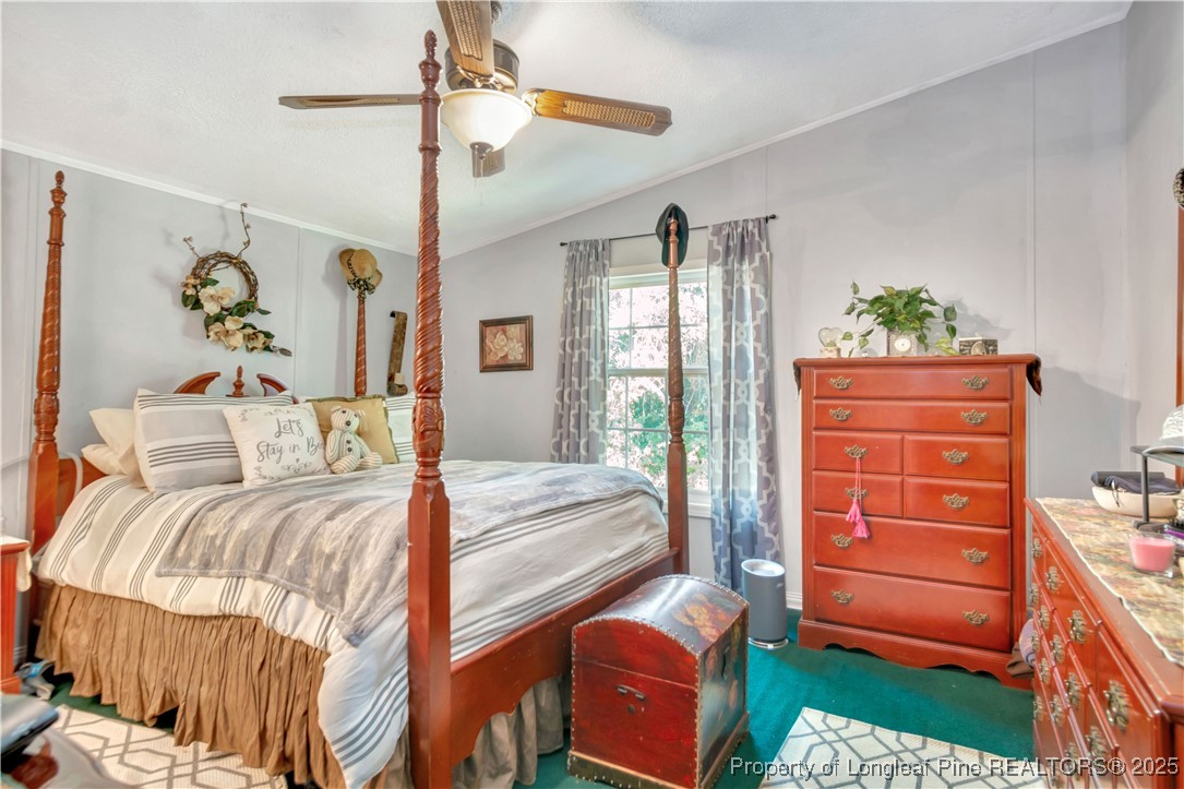 437 Paul Road Pembroke, NC 28372 - Photo 18 of 28 a bedroom with a bed and a dresser