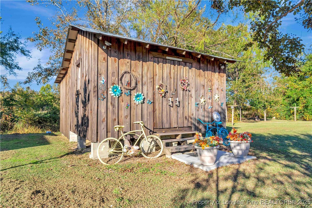 437 Paul Road Pembroke, NC 28372 - Photo 26 of 28 a view of back yard of the house