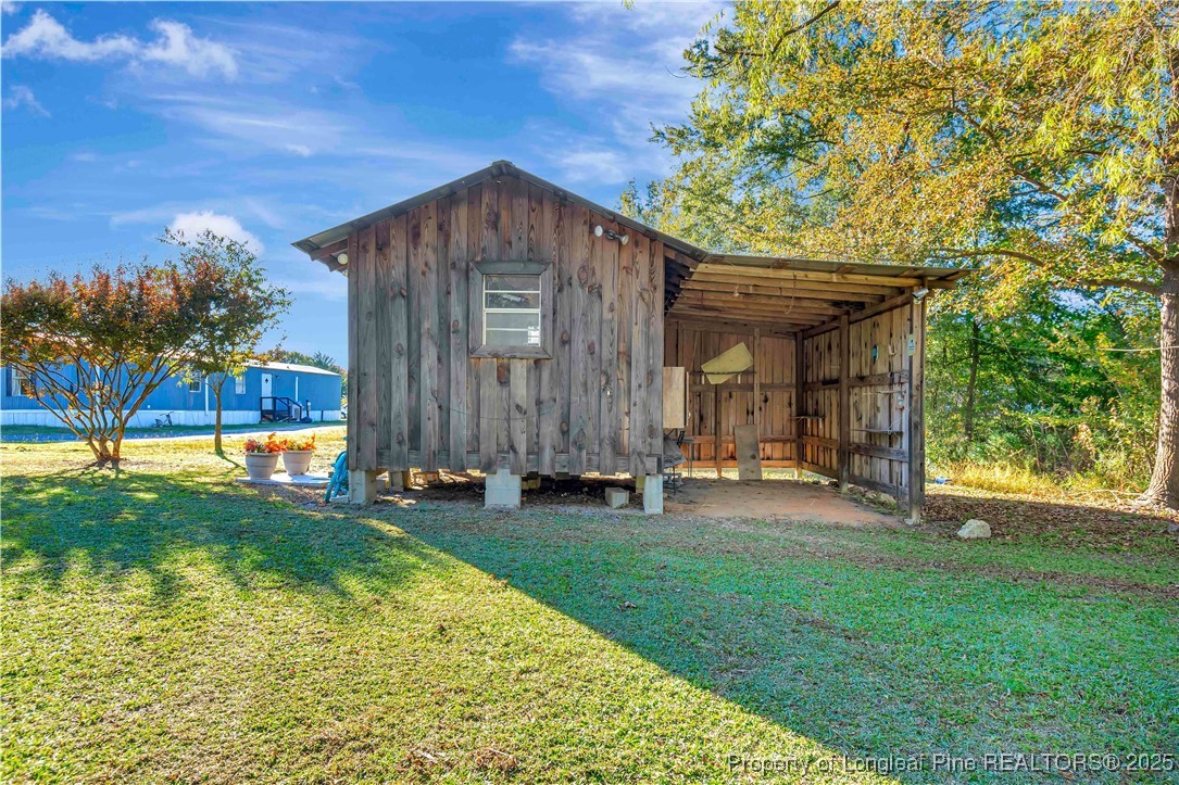 437 Paul Road Pembroke, NC 28372 - Photo 27 of 28 a house view with a garden space