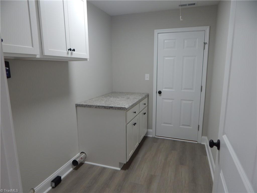 2126 Waterford Pointe Road Lexington, NC 27292 - Photo 13 of 15 Separate laundry room with access from garage. Notice folding counter.