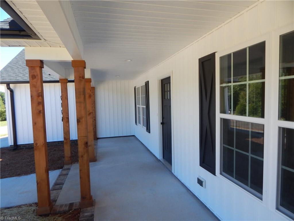 2126 Waterford Pointe Road Lexington, NC 27292 - Photo 3 of 15 Almost year round enoyment of 30' covered porch. Perfect for swing or rockers