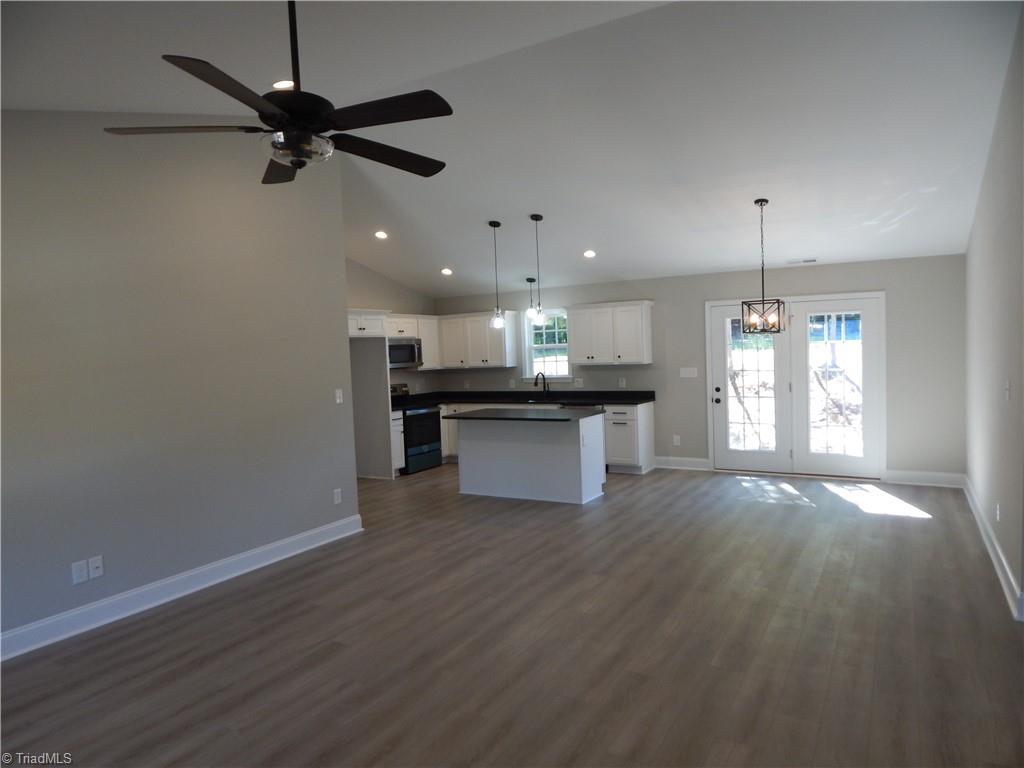 2126 Waterford Pointe Road Lexington, NC 27292 - Photo 4 of 15 Expansive open floor plan flows freely through living room, dining, and kitchen. Access from dining to rear patio.