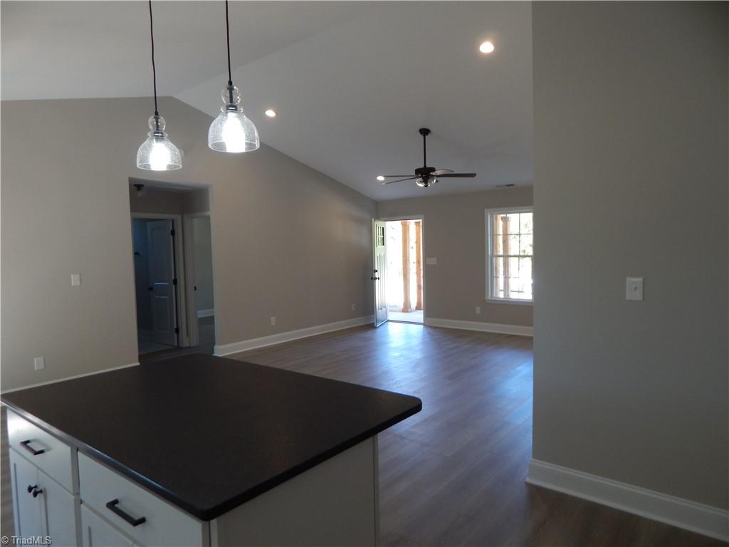 2126 Waterford Pointe Road Lexington, NC 27292 - Photo 6 of 15 View across kitchen island to front of house. Notice wood floors and high ceilings