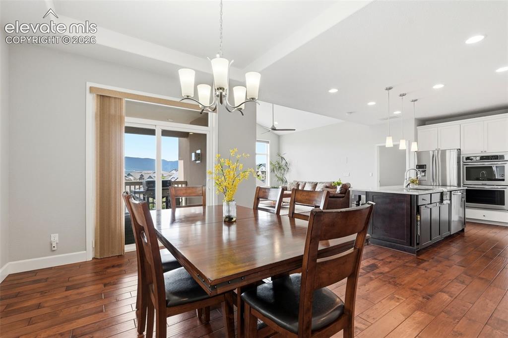 1394 Promontory Bluff View Colorado Springs, CO 80921 - Photo 4 of 47 a view of a dining room with furniture