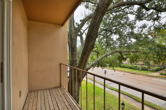 a view of balcony with wooden floor