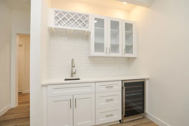 a kitchen with a sink and cabinets
