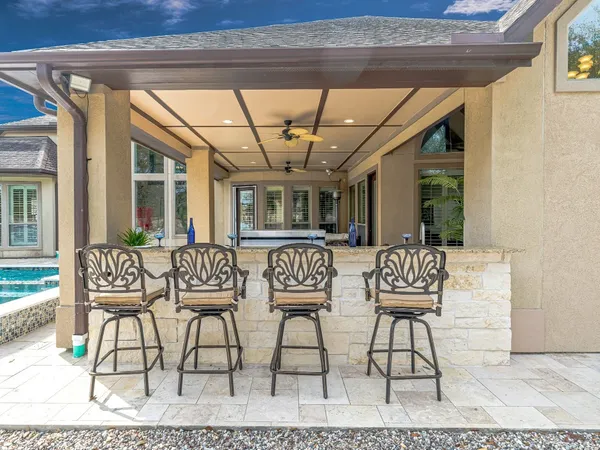 a view of a chairs and table in a patio