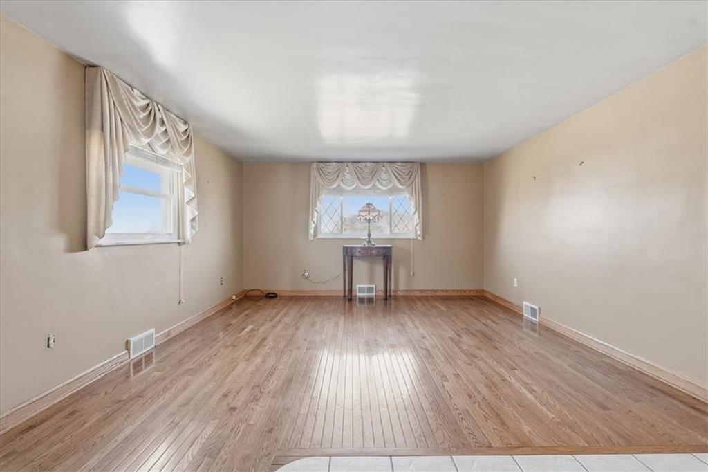 2355 Calvert Street Aliquippa, PA 15001 - Photo 15 of 28 an empty room with wooden floor and windows